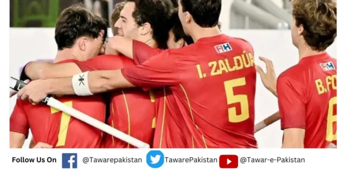 Spanish hockey team players celebrate during the quarter-final match with Pakistan.