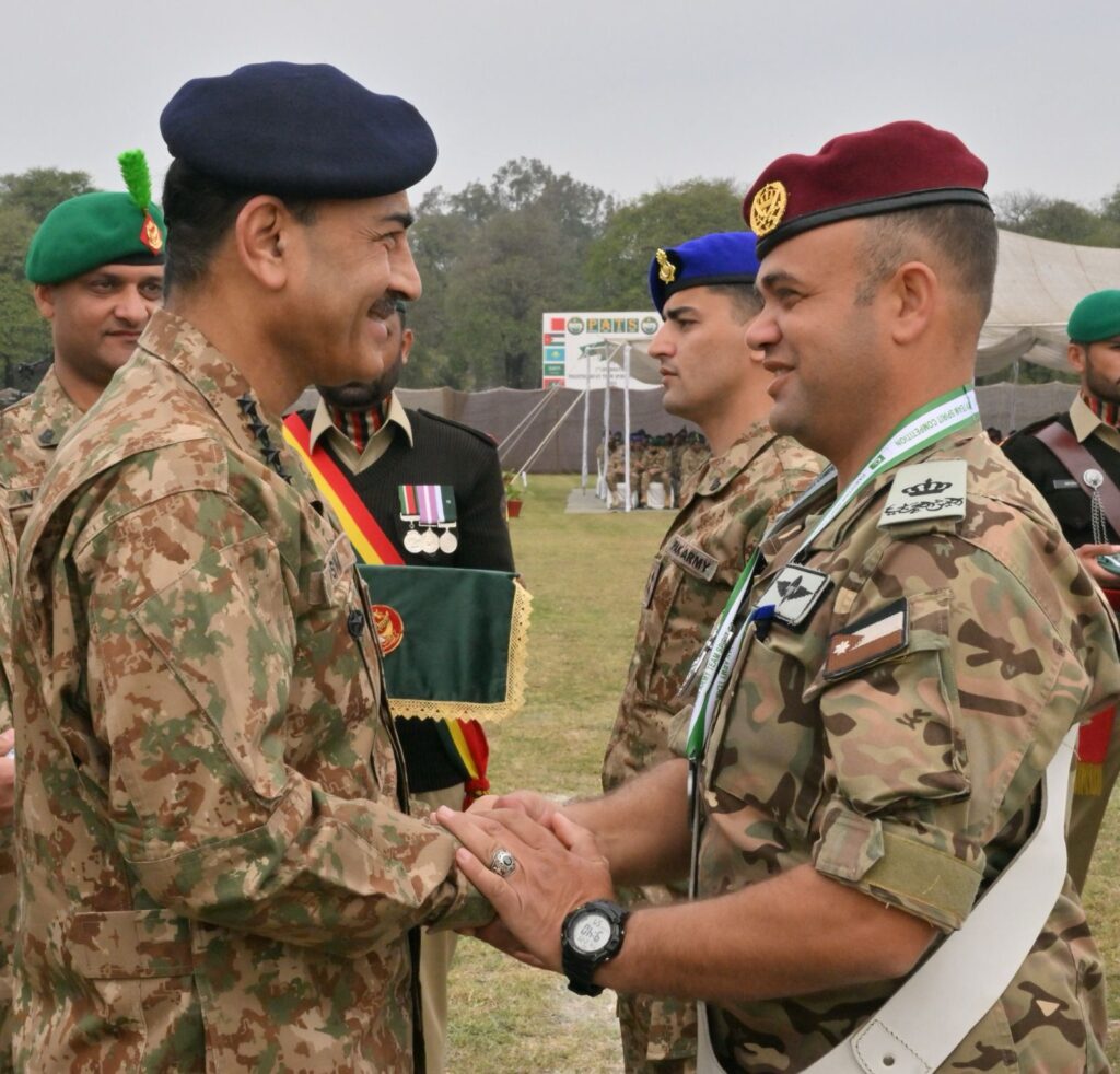 Chief of Army Staff handshakes with the participants